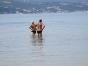 two almost swimmers in the deadly calm Ionian Sea.